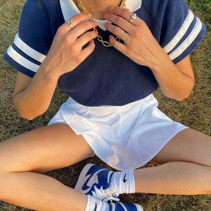 Rachel – Retro Marineblauw Polo Nek T-shirt met Korte Mouwen